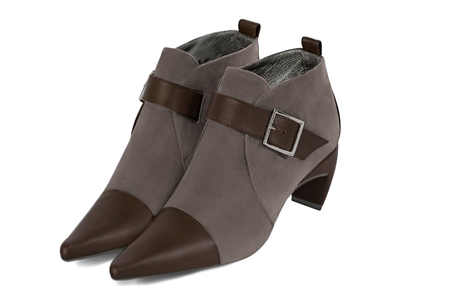 Women's dark brown and taupe brown elegant ankle boots, with buckles at the front. Pointed toe. Medium comma heels - Front view